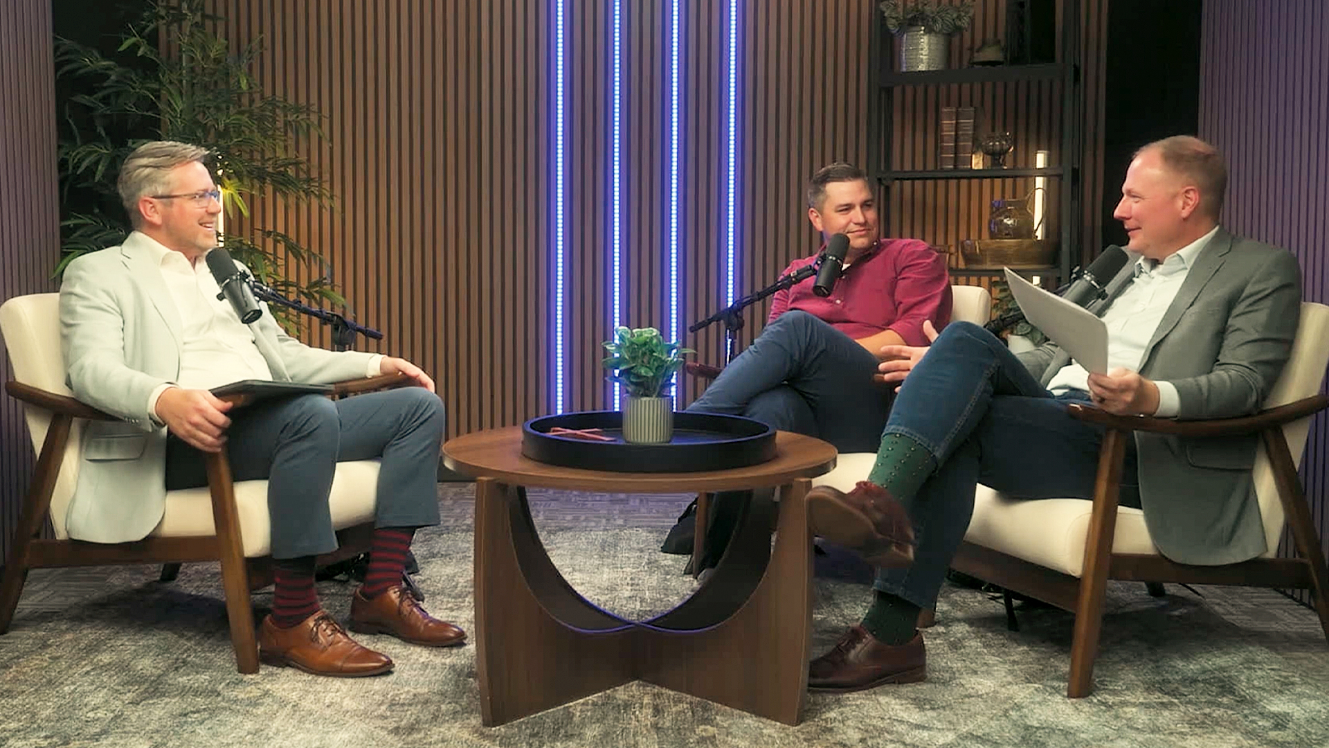 Three pastors sit in the Voices of Trinity podcast studio